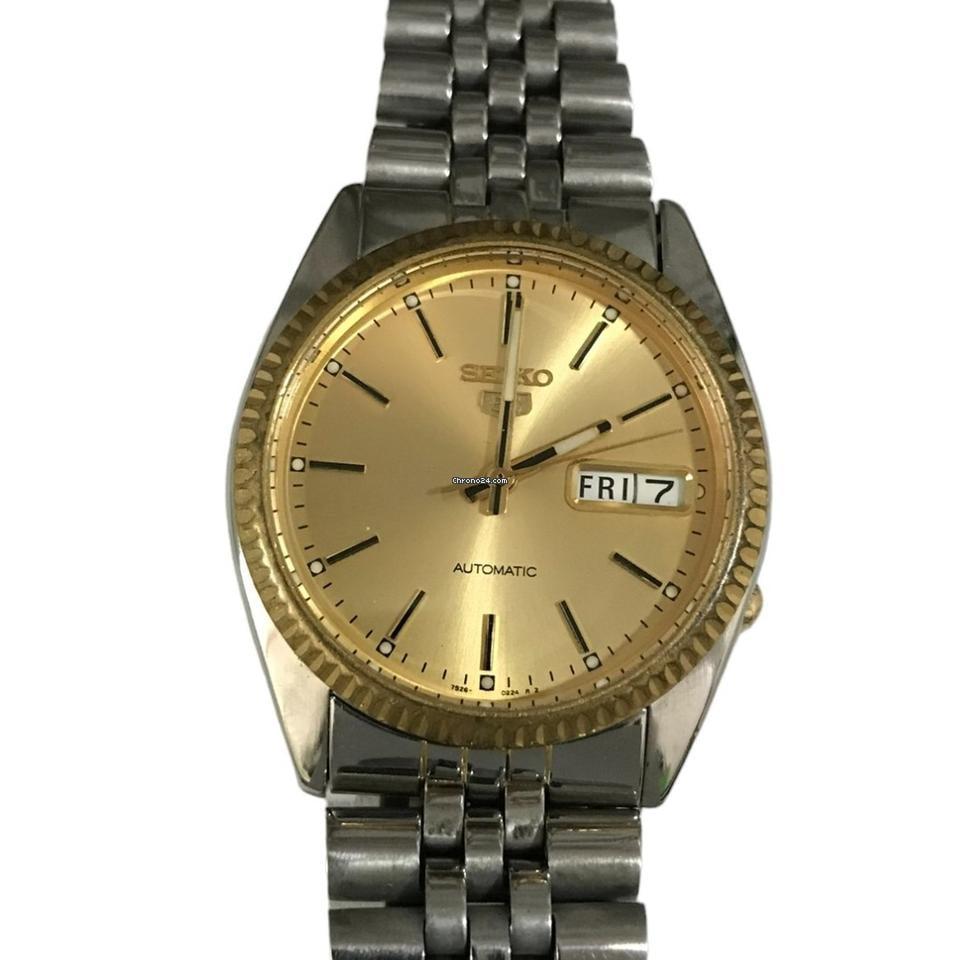 Seiko 5
 
 Automatic fluted bezel Gold Dial Stainless Steel Watch 7S26-3110 RARE
 
 For sale is this
